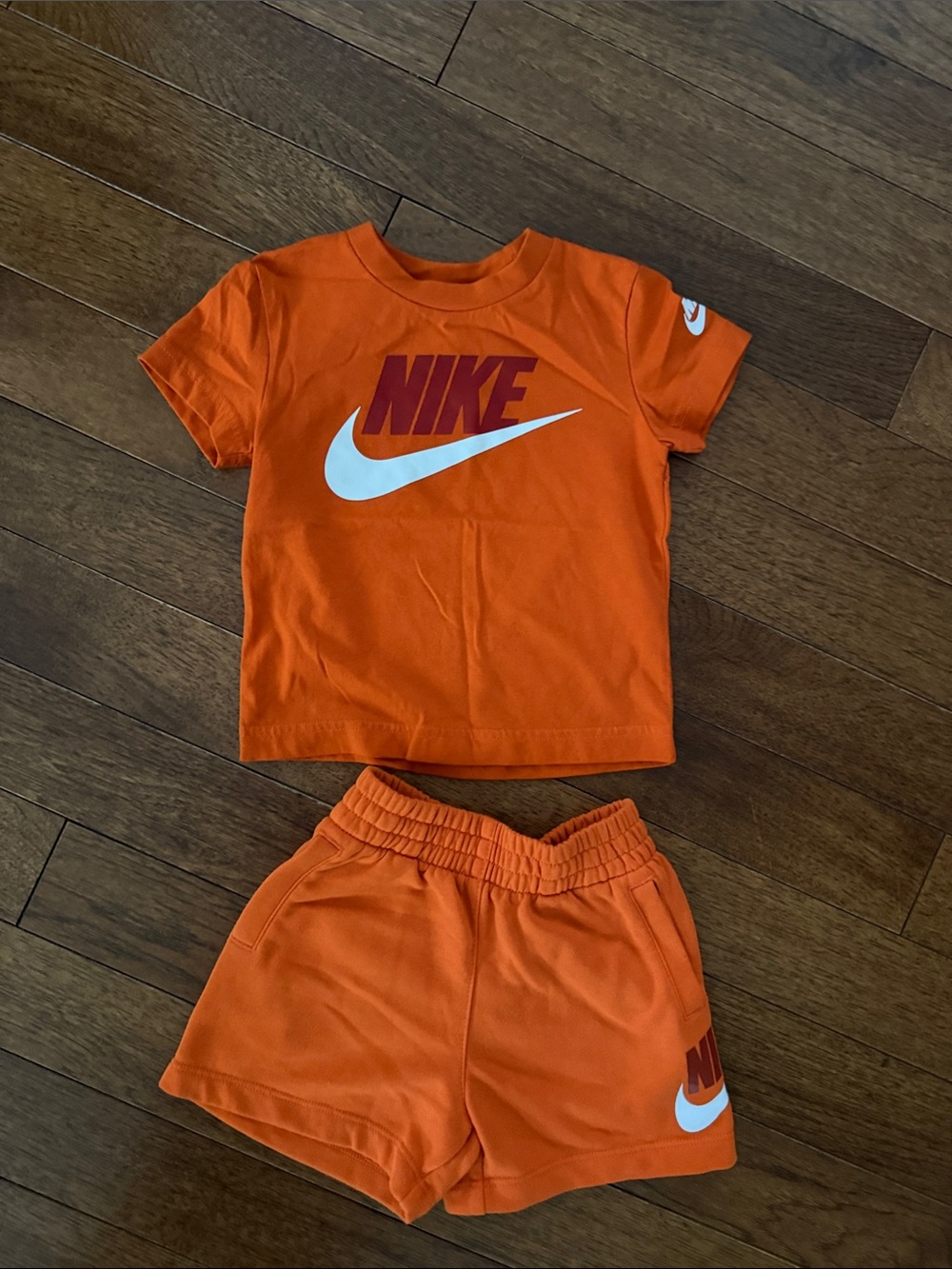 Nike Orange Kids Two-Piece Tee & Shorts Set with White Swoosh